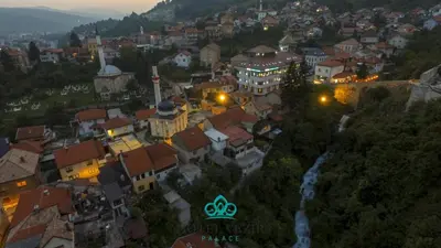 a view of a town at night with lights at Hotel Vezir Palace in Travnik