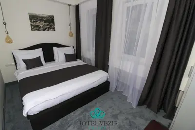 a bedroom with a bed and a window at Hotel Vezir Palace in Travnik