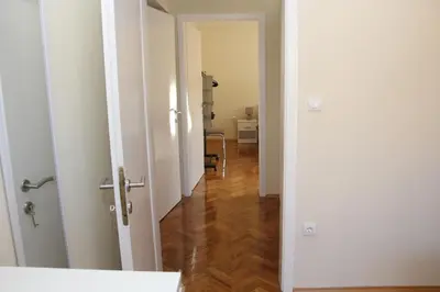 an open door to a room with a hallway at Magnolija in Banja Luka