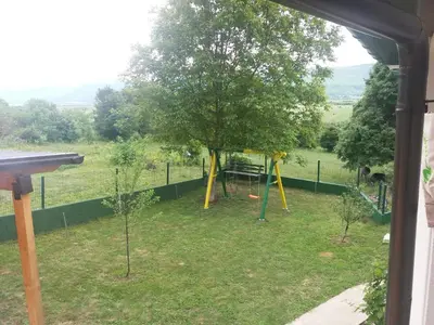 a view of a yard with a playground at Weekend House Petar in Lusnić