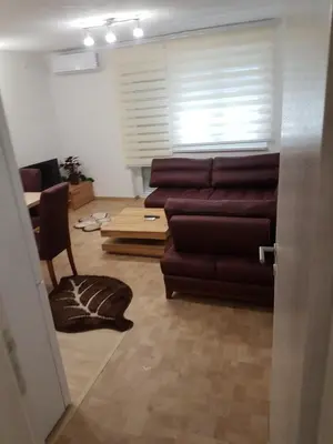 a living room with a couch and a table at Apartment Centar LUX in Banja Luka