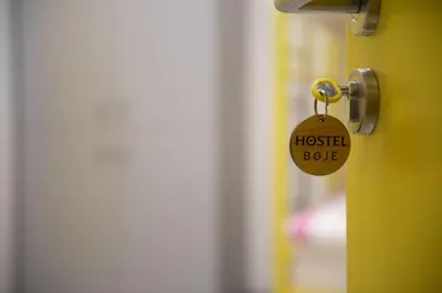 a lock on a door with a hostel bug tag on it at Hostel Boje in Livno