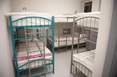 a room with three bunk beds in a room at Hostel Boje in Livno