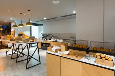 a kitchen with a bunch of fruits and vegetables on counters at Courtyard by Marriott Banja Luka in Banja Luka