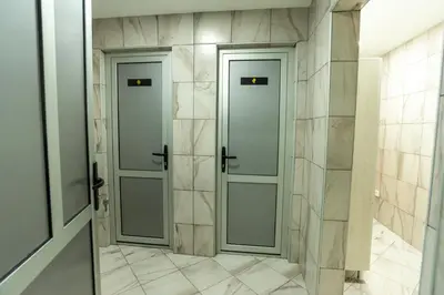 two doors in a hallway with marble tiles at HOTEL Villa Grande in Bugojno