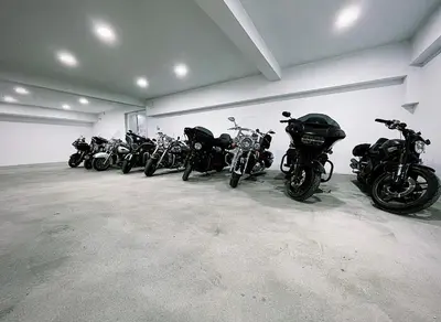 a row of motorcycles parked in a garage at HOTEL Villa Grande in Bugojno