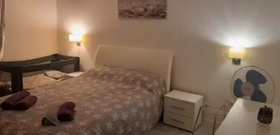 a small bedroom with a bed and a piano at VISOKO COMFORT suite in Visoko