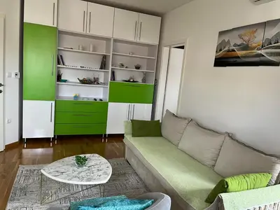 a living room with a couch and a table at Relax Teslić in Teslić