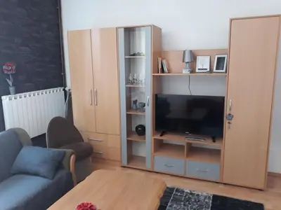 a living room with a couch and a television at Irma in Tuzla