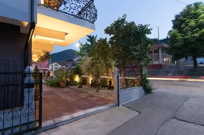 a wrought iron gate to a building with a sidewalk at APARTMENTS VRANAS in Visoko