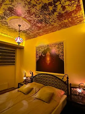 a bedroom with two beds and a painting on the ceiling at APARTMENTS VRANAS in Visoko