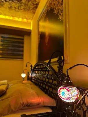 a bedroom with a bed and a lamp on a table at APARTMENTS VRANAS in Visoko