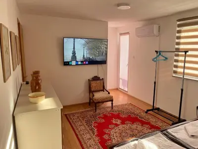 a living room with a tv on the wall at Holiday Residence Burić in Visoko