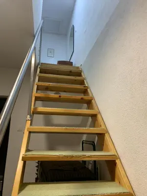 a set of stairs leading up to the second floor of a building at Holiday Residence Burić in Visoko