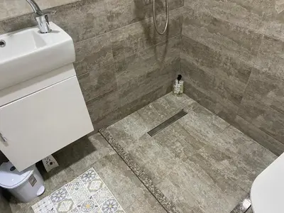 a bathroom with a sink and a toilet in a shower at Villa Queen in Visoko