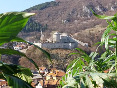 a town on a hill with a castle on it at Panorama Travnik in Travnik