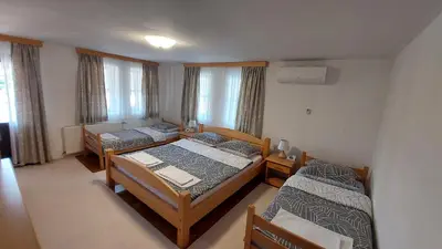 a room with two beds and two beds sidx sidx sidx sidx at Panorama Travnik in Travnik