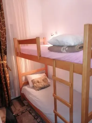 a couple of bunk beds in a room at Excellency apartmani in Banja Luka