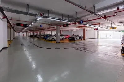 an empty parking garage with cars parked in it at Hotel IUT in Travnik