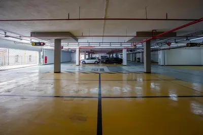 an empty parking garage with a car parked in it at Hotel IUT in Travnik