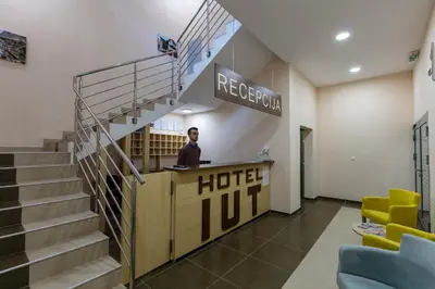 a man standing at a hotel lobby at Hotel IUT in Travnik