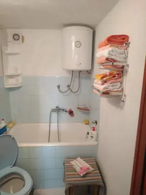 a bathroom with a bath tub and a toilet at Apartman Ana in Livno