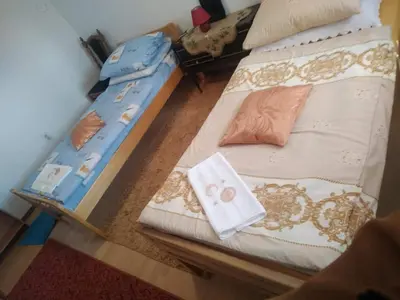 a bedroom with two beds with pillows on them at Apartman Ana in Livno