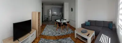 a living room with a couch and a flat screen tv at Apartment Emina in Travnik