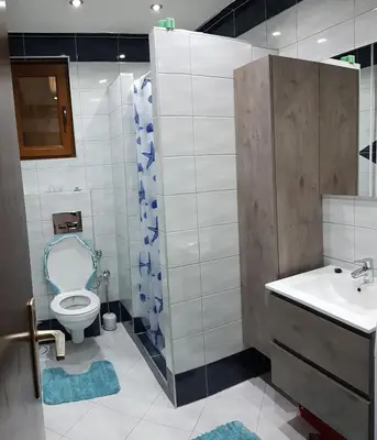 a bathroom with a toilet and a sink at Apartment Emina in Travnik