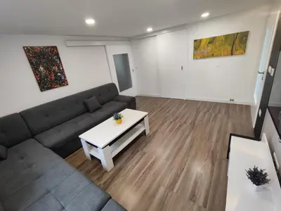 a living room with a couch and a table at Kuća Vila Nina in Tomislavgrad