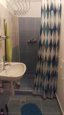 a bathroom with a sink and a shower at Studio apartman Ela in Travnik
