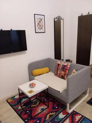 a living room with a couch and a table at Studio apartman Ela in Travnik