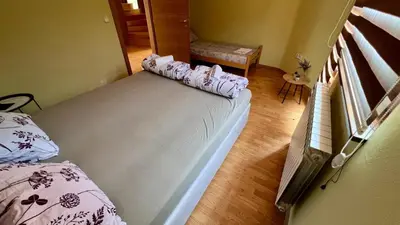 a bedroom with a bed with pillows on it at Villa Sun Visoko in Visoko