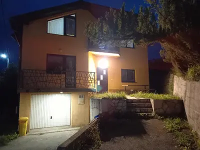 a house with a white garage at night at Villa Sun Visoko in Visoko