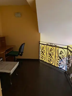 a balcony with a chair and a desk at Villa Sun Visoko in Visoko