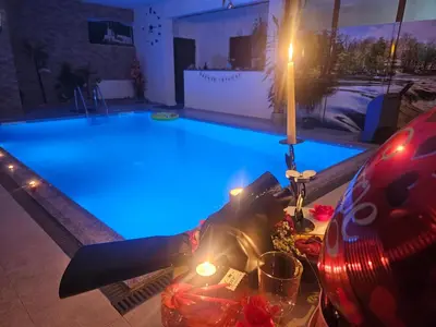 a large pool with a plane sitting in it at Villa Adanis in Bihać