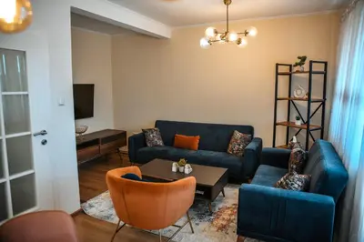 a living room with a couch and a table at Apartments Centar in Živinice