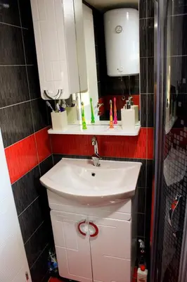 a bathroom with a white sink and a shower at 