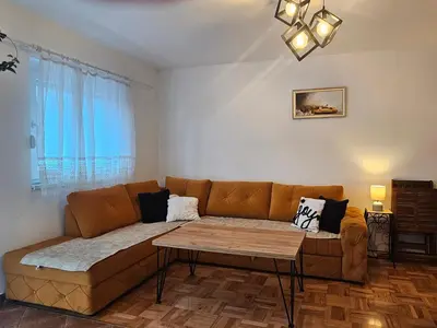 a living room with a couch and a table at Vikendica Kod Koje in Banja Luka