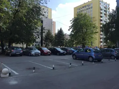 a bunch of cars parked in a parking lot at Apartment Palas in Banja Luka