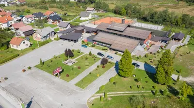 an aerial view of a town with a park at Hotel TISA in Busovača
