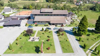 an aerial view of a building with a park at Hotel TISA in Busovača