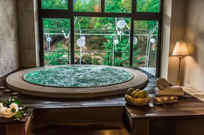 a large bath tub in a room with a window at Hotel Kostelski Buk in Bihać