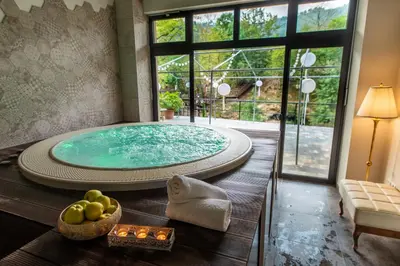 a large jacuzzi tub in a room at Hotel Kostelski Buk in Bihać
