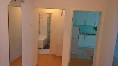 a room with a bathroom with a tub and a sink at Apartman centar lux in Tuzla