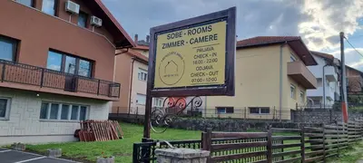 a sign in front of a house at Aman Guesthouse in Bihać