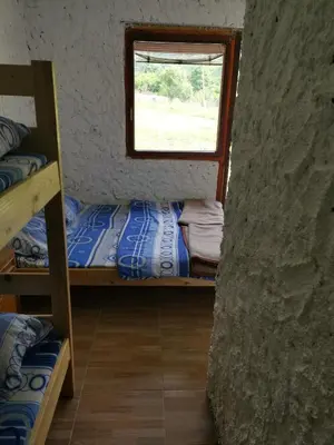 a room with two bunk beds and a window at Lux bungalow in Foča