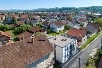 an aerial view of a town with houses at Hazam Aparthotel in Sanski most