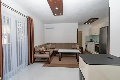 a living room with a couch and a table at Hazam Aparthotel in Sanski most