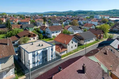 an aerial view of a residential suburb with houses at Hazam Aparthotel in Sanski most